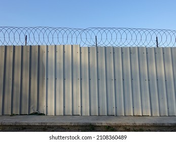 Metal fence with razor wire