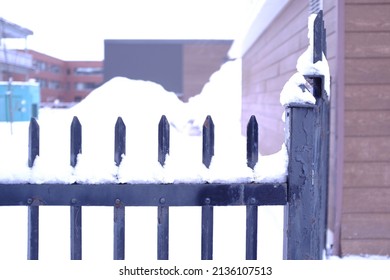 A Metal Fence In Winter