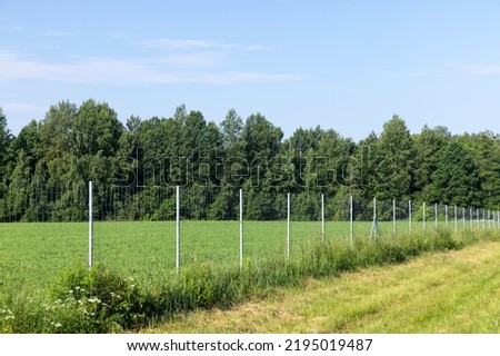 Metal fences for animal protection, an iron fence near the expressway to restrict the exit of animals to the roadway
