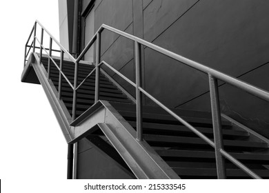 Metal fire escape or emergency exit on Black Wall of Building With Isolated White Background - Powered by Shutterstock