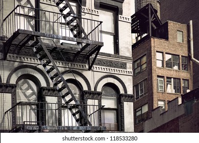 Metal fire escape on facade of old building in New York City