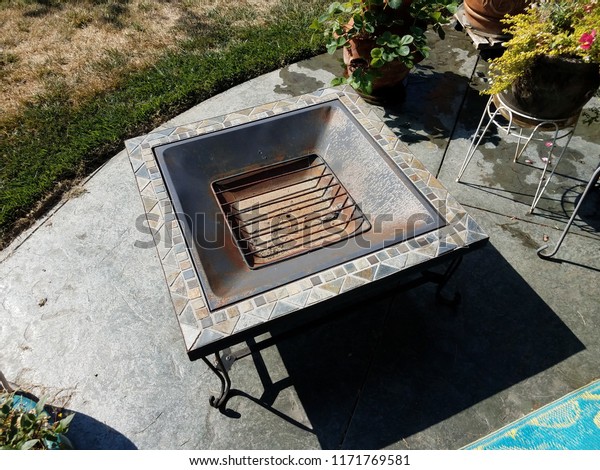 Metal Fire Pit Grill On Cement Royalty Free Stock Image