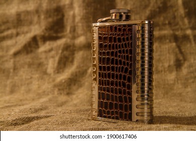 Metal Flask For Alcohol. Warm Lighting.