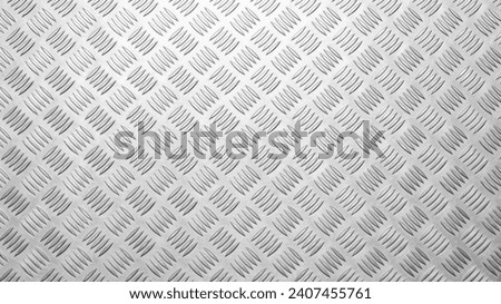 Metal floor plate with diamond pattern texture background.