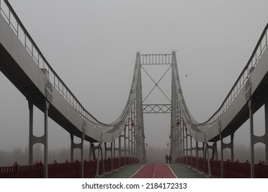 A Metal Footbridge In A Foggy Morning.