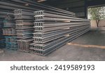 Metal forming steel beams at the metal products warehouse, H-beam steel and Wi-Frank steel. For large structures or building columns, focus only on the raw materials used in building construction.