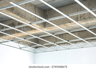 The metal framework for the suspended ceiling is currently being installed.
The C-line main runners and cross tees are neatly aligned to create a sturdy base for the ceiling.