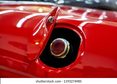 The Metal Fuel Tank Cap Of The Red Classic Car After Polished And Coated. Car Detailing & Restoration Of The Retro Classic Car. Selective Focus.