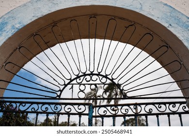 Metal gate dated 1898 with cloud SKY