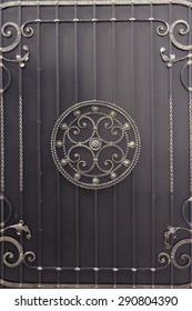Metal gate with forged pattern.
