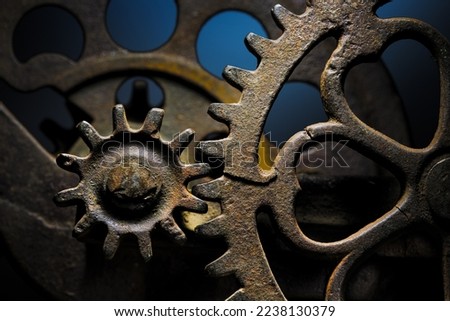 Metal gear sprockets in well used machine, old and rusted closeup still life with beautiful textures and shape. Fine art