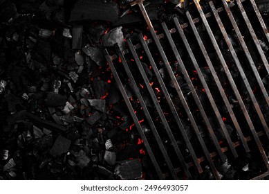 Metal grate for grilling on glowing hot charcoal. Top view. Free space for text.