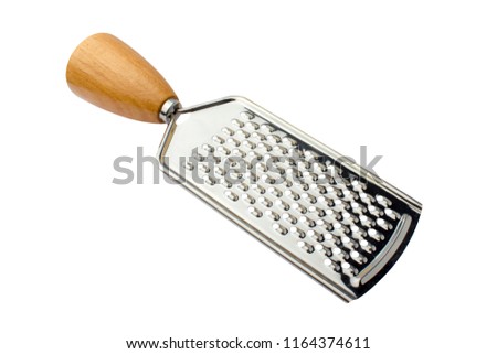 Metal grater with a wooden handle on a white background. Isolated object