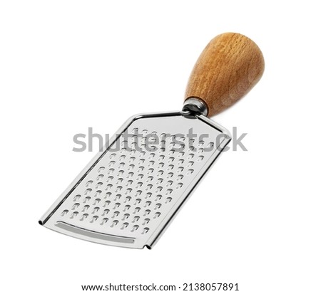 Metal grater with a wooden handle on a white background. isolated object