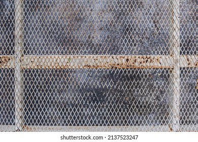 A metal grid background was used to create a high-altitude walking grate as it was lighter than concrete and was visible below. Full frame metal grid backgrounds are perfect for design projects.