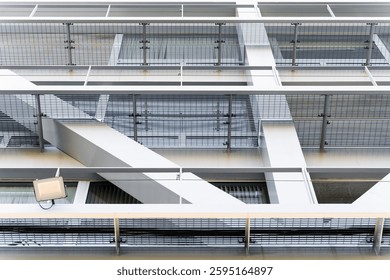 Metal grids and geometric patterns create a visually striking facade on a modern building, showcasing contemporary architectural design