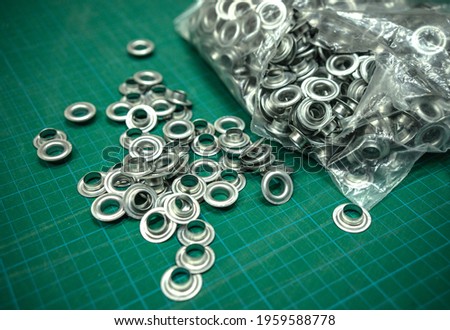 Metal grommets for fabric and advertising banners.