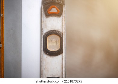 Metal Guide Beacons Are Attached To The Wall, The Master Checks The Beacons For Equality Of The Plane Rule, Building Rule With Level And Metal Beacon.