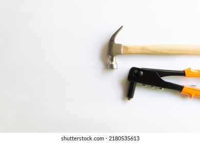 Metal Hammer With Wood Handle And Rivet Tool With Various Layouts Isolated On A White Background.