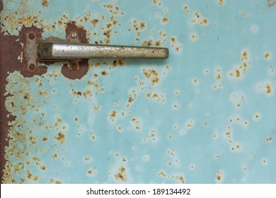 The metal handle of  old refrigerator.