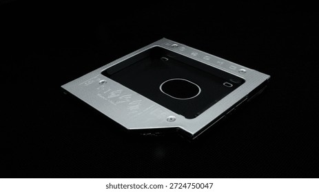 Metal hard disk for data storage isolated on black background