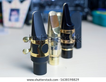 Metal and hard rubber Mouthpieces for Tenor Sax - close up and selective focus