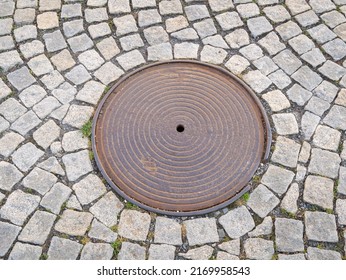 Metal Hatch On Paving Stones.