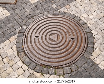 Metal Hatch On Paving Stones.