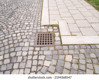 Metal Hatch On Paving Stones.