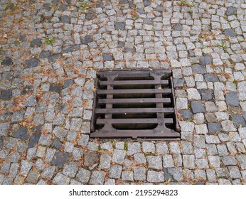 Metal Hatch On Paving Stones.