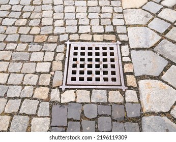 Metal Hatch On Paving Stones.