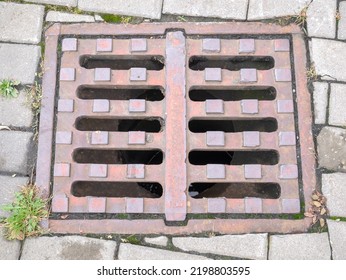 Metal Hatch On Paving Stones.