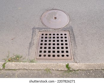 Metal Hatch On Paving Stones.