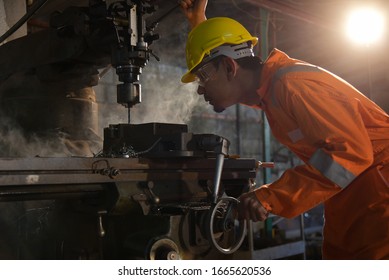 Metal hole drilling on vertical drilling machines with turning tools at the factory - Powered by Shutterstock