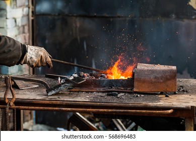 The Metal Hook Blacksmith. Hot Coals. Tables Metal Smith