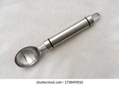 Metal Ice Cream Spoon On Fabric Surface