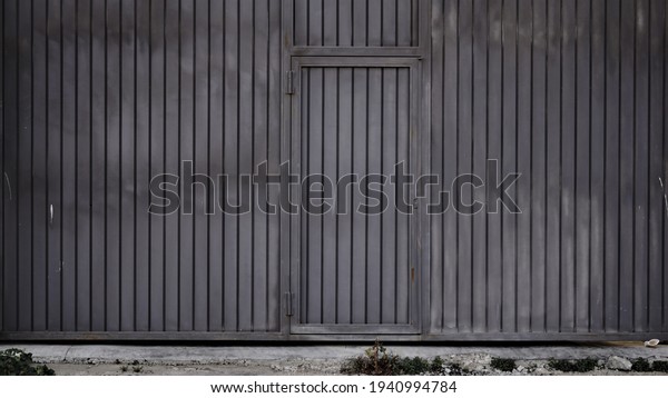 metal\
industrial building dark door as\
background
