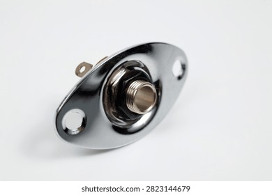Metal jack input socket for an electric guitar.