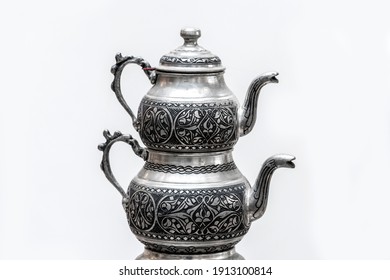 Metal kettle on a white background