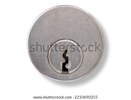 Metal key plate with keyhole of a cylinder lock in a door with dropdown shadow. Isolated on white background