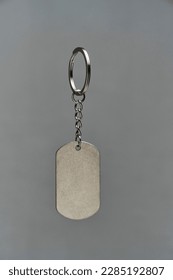 Metal keychain on a gray background