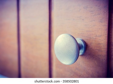 Metal Knob On Wood Drawer