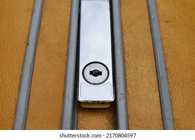 Metal Latch On A Yellow Suitcase