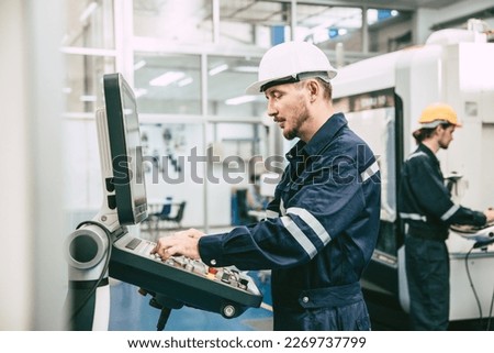 Metal Lathe CNC Machine Engineer Worker. Engineering Staff working in precision metal parts factory Сток-фото © 