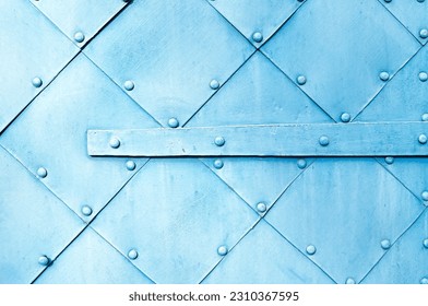 Metal light blue surface of old hammered metal plates with rivets and architectural details on them. Metal industrial background.  - Powered by Shutterstock