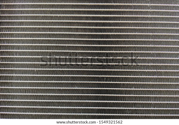 Metal lines in\
car radiator macro close up\
view