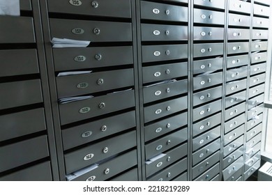 Metal mailboxes a lot. Residential metal postboxes with apartment numbers at modern multifamily building. - Shutterstock ID 2218219289
