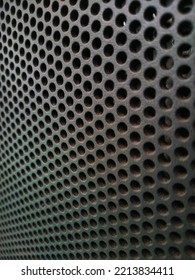 Metal Mesh. Perforated Steel Surface Background