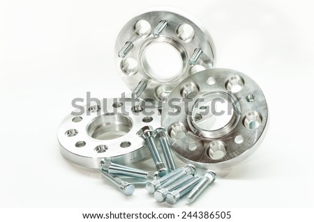 Metal mold of flanges and bolts. CNC milling and lathe industry. Metal engineering. Indoors closeup on white background.