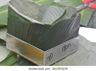 Metal Mold For Making Vietnamese New Year Banh Chung Cake, And A Banana Leaf Inside The Mold